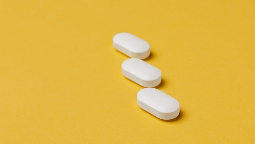 pills on a yellow background