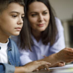 mom and son at computer